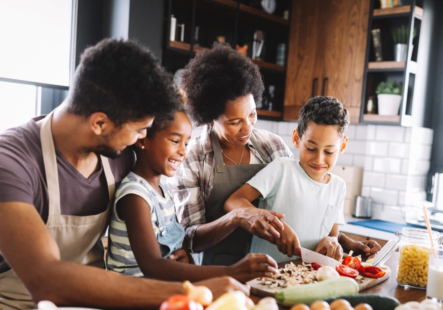 Happy,African,American,Family,Preparing,Healthy,Food,Together,In,Kitchen